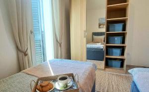 Postel nebo postele na pokoji v ubytování Apartment Zefiro + 3 fotografie