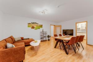 a living room with a couch and a table at Bauer Haug in Dietmannsried