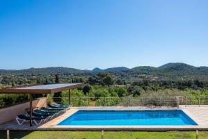 a villa with a swimming pool and a view at Finca Bionic in Artá