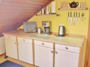a kitchen with a counter with a sink and a counter at Geräumiges Apartment mit Panoramabergblick in Sankt Michael im Lungau