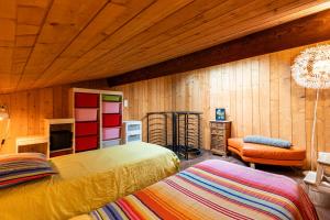 Postel nebo postele na pokoji v ubytování La Cabane d'Ana