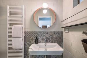 a bathroom with a sink and a mirror at Ferienwohnung Zwei in Saal +16 photos