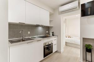 Η κουζίνα ή μικρή κουζίνα στο Cala Arena-few steps from the beach +27 φωτογραφίες