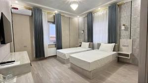 TV a/nebo společenská místnost v ubytování Twins Hotel Khiva