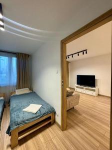 Postel nebo postele na pokoji v ubytování Apartament Bałandy 18