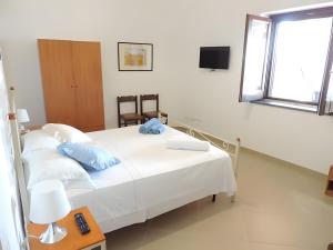 Postel nebo postele na pokoji v ubytování Case Maiolica