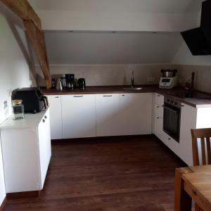 Kuchyň nebo kuchyňský kout v ubytování Hartmannshof