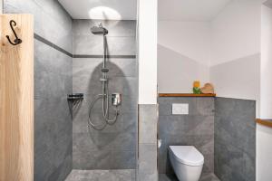 a bathroom with a shower and a toilet at Ferienwohnung Nordic -Reit im Winkl in Reit im Winkl +21 photos