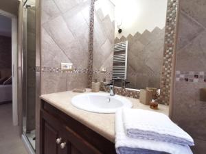 a bathroom with a sink and a shower at Lux Energy Room and Garden in Olbia +25 photos