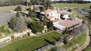 an aerial view of a large house with a yard at Brugarolas Village in Castelltersol