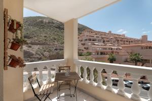 a balcony with a view of a building at Estupendo Estudio En Castle Harbour in Los Cristianos