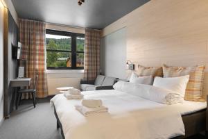 Postel nebo postele na pokoji v ubytování Trysil Hotel + 32 fotografií