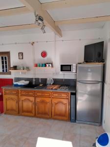 Kuchyň nebo kuchyňský kout v ubytování Maison avec jardin arboré + 2 fotografie