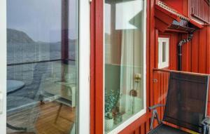 a window with a view of the ocean from a boat at Nice Apartment In Korshamn With House Sea View in Korshamn +5 photos