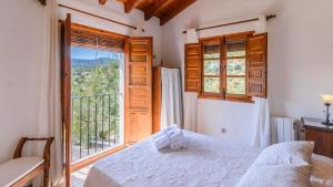 Postel nebo postele na pokoji v ubytování Casa Guajar Monda by Ruralidays