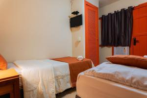 Postel nebo postele na pokoji v ubytování Pousada Viver Búzios