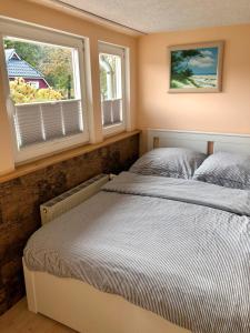 Postel nebo postele na pokoji v ubytování Ferienwohnungen Natur Und Kultur