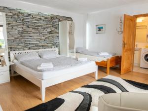 Un ou plusieurs lits dans un hébergement de l'établissement Ferienunterkunfte Wusterhusen