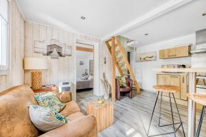 a living room with a couch and a table at Bastide De Mongiraud in Blanquefort