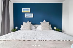 Giường trong phòng chung tại Ferienwohnung Strandgut Olpenitz