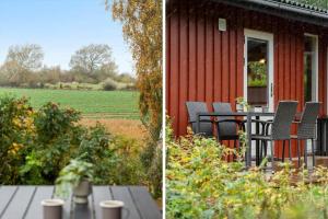 a red house with chairs and a table and a field at LL258-Humble-Paradisvejen-11 in Østerskov +13 photos