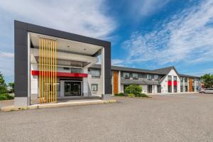 a rendering of a building in a parking lot at Comfort Inn East in Sudbury