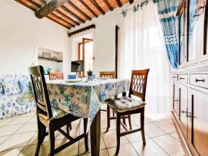 a kitchen and dining room with a table and chairs at Casa Veronica Rio Marina in Rio Marina +21 photos