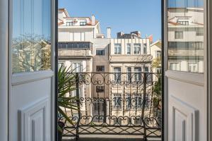 an open window with a view of a building at GuestReady - Charming House Marquês in Porto