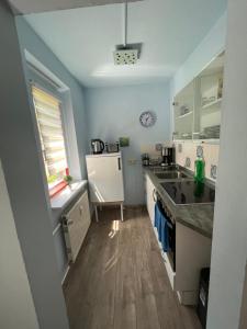 a kitchen with a sink and a counter top at gemütliche kleine Ferienwohnung in Altenberg in Kurort Altenberg
