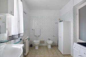 a bathroom with a toilet and a sink at Da Chicca in Bolano +14 photos