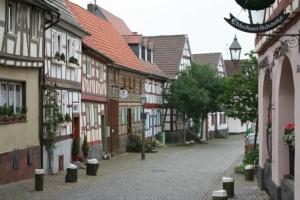 an empty street in a town with buildings at Maintal Apartment 2 in Maintal