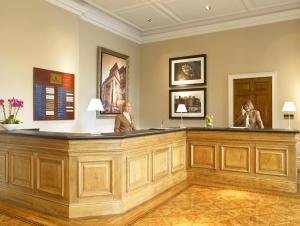 two women sitting at a bar in a waiting room at De Vere Cranage Estate in Holmes Chapel