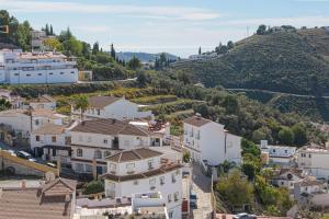 a village on a hill with white houses at Casa Jabe in Cómpeta