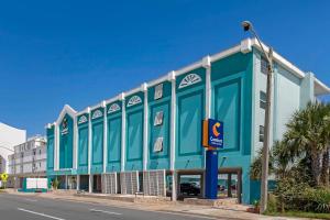 a blue building on the side of a street at Comfort Inn & Suites Ormond Beach Oceanfront in Ormond Beach