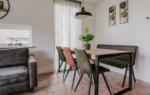 a dining room with a table and chairs at Busch & Dam in Uitgeest