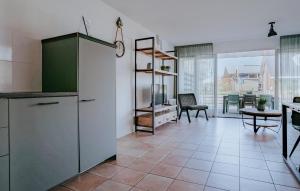 a kitchen with a counter and a dining room at Busch & Dam in Uitgeest