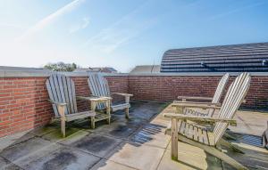 two chairs and a table on a roof at Saskerlei in Uitgeest +9 photos