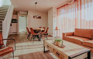 a living room with a couch and a table at Saskerlei in Uitgeest