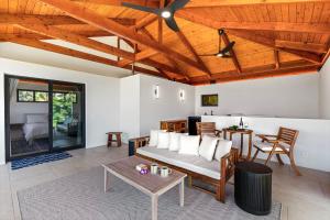 a living room with a couch and a table at Manu O Ku in Kailua-Kona