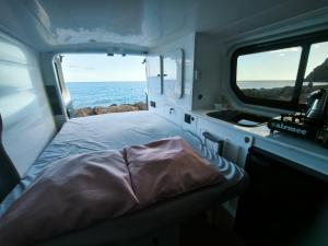 a room with a bed in the middle of a boat at Vancamper in Santa Cruz de Tenerife