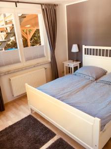 Postel nebo postele na pokoji v ubytování Ferienwohnungen Natur Und Kultur