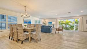 a living room with a table and a couch at Island Escape - 638 in Siesta Key
