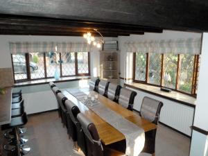 a dining room with a long table and chairs at Lambourne House - Ukc2831 in Winthorpe