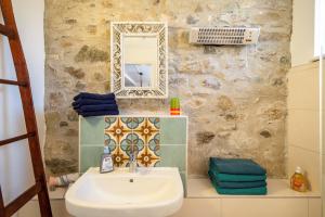 a bathroom with a sink and a mirror at Artesana 2 Bleichnau in Tettnang +14 photos