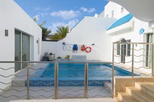 a house with a swimming pool on a balcony at درة العروس فيلا الأحلام d in Jeddah