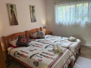 Ένα ή περισσότερα κρεβάτια σε δωμάτιο στο Birdsnest Guest Accommodation