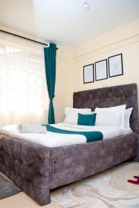 Ένα ή περισσότερα κρεβάτια σε δωμάτιο στο Sekani Homes +16 φωτογραφίες