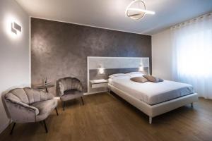 Ένα ή περισσότερα κρεβάτια σε δωμάτιο στο LA Maison