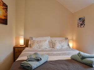 Voodi või voodid majutusasutuse Derwent Cottage toas +11 fotot