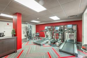 a gym with treadmills and machines in a room at Inn at the Peachtrees, an Ascend Collection Hotel in Atlanta